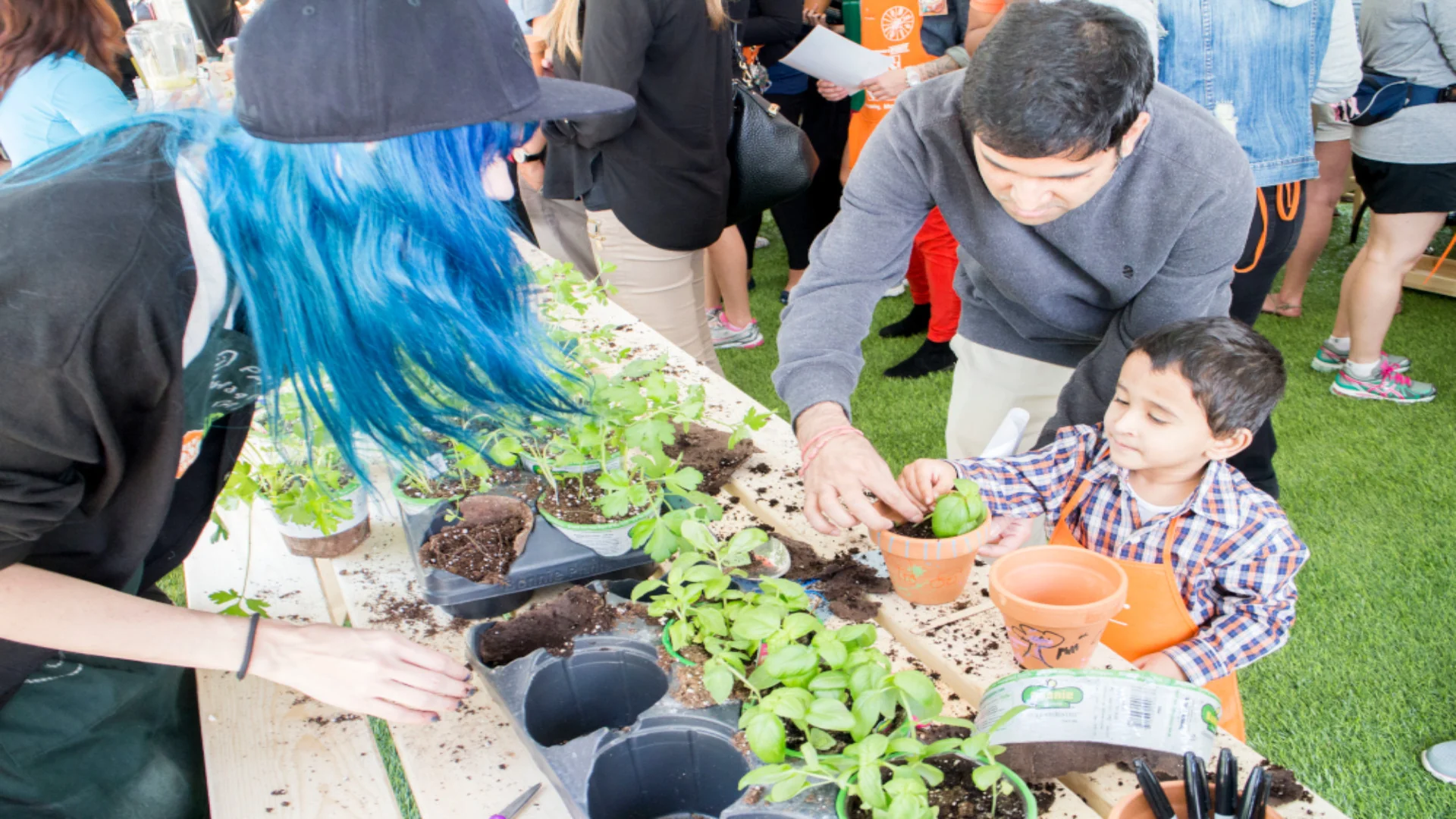 Garden Party participants learning to plant together