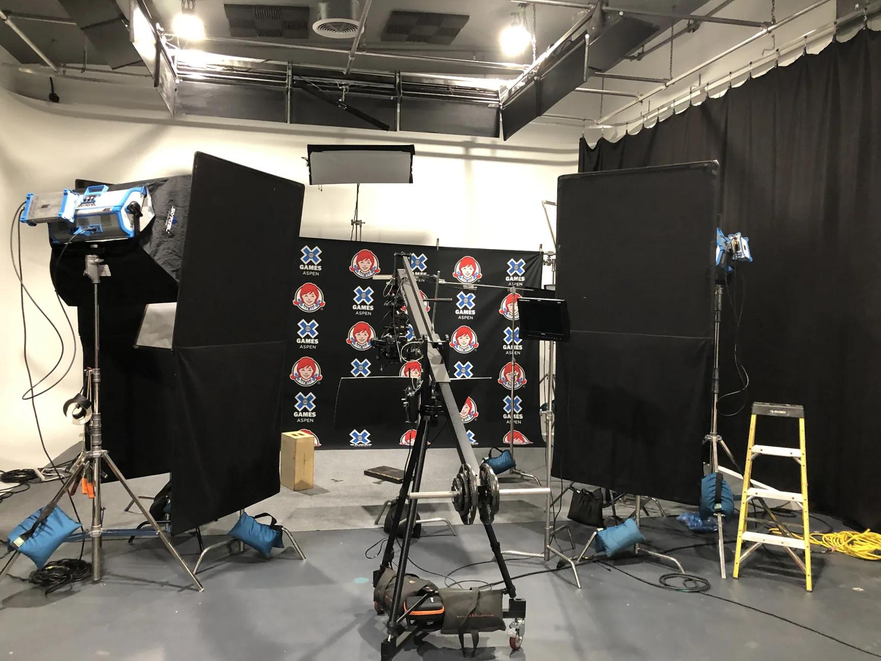 Lighting, cameras and Wendy's X Games Aspen backdrop on the production set
