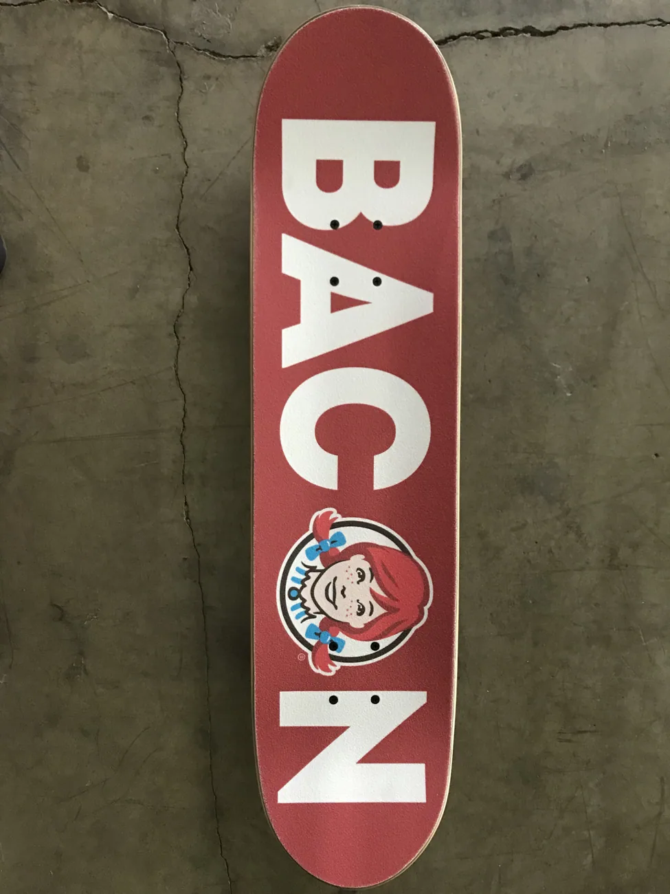 Custom Wendy's Bacon skateboard deck, grip side