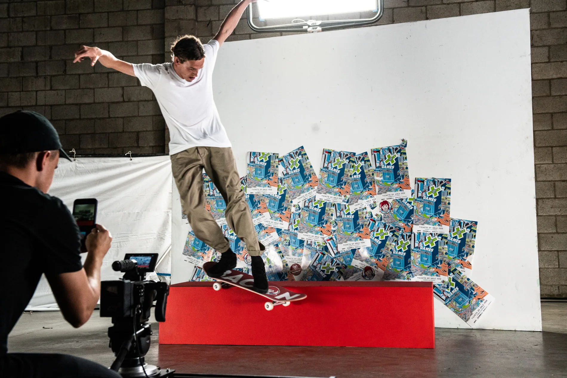 Skateboarder and camera operator on the Bacon Boards production set